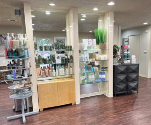 - Results Salon and Spa in Kingsport, TN Shelves display various hair and skin care products in a well-lit salon with wood floors and modern decor. - Results Salon and Spa in Kingsport, TN