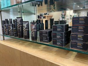 - Results Salon and Spa in Kingsport, TN Shelves display bottles, tubes, and boxes of Aveda Men Pure-Formance grooming products in a salon or retail setting. - Results Salon and Spa in Kingsport, TN