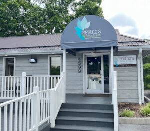- Results Salon and Spa in Kingsport, TN Entrance of Results Salon & Spa with a gray awning, sign, white railing, and steps leading to the front door. Building is light gray with trees in the background. - Results Salon and Spa in Kingsport, TN